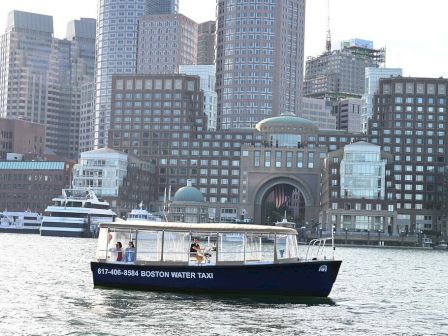 A water taxi labeled 