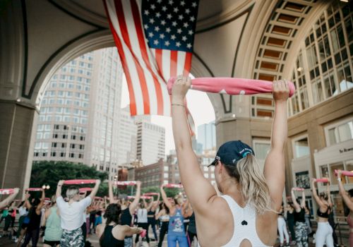 Women leading a fitness class under an archway