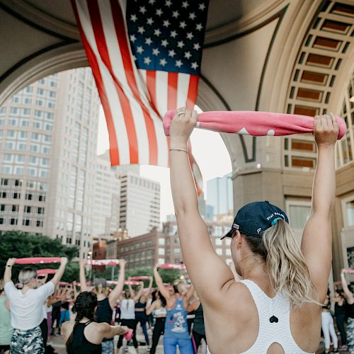 Women leading a fitness class under an archway