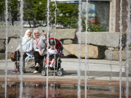 Family enjoying the Rings Fountain in Boston taken by Anthony Crisafulli