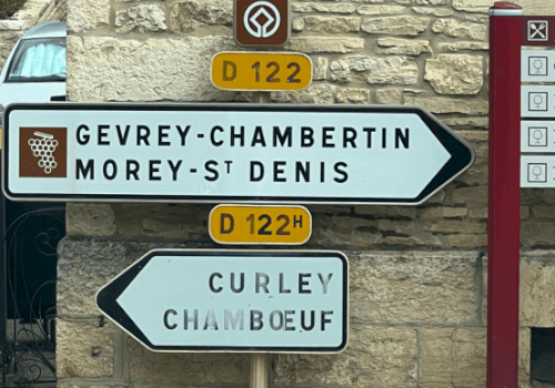 Road signs point to Gevrey-Chambertin, Morey-St Denis, Curley, and Chamboeuf via routes D122 and D122H.